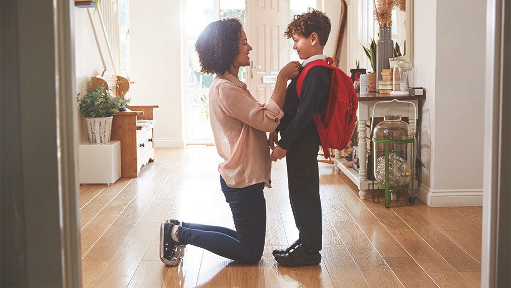 Parent with kid getting ready for school
